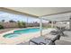 Beautiful backyard featuring a swimming pool, spa, covered patio, and lounge chairs at 4753 Carefree Dr, Las Vegas, NV 89122