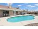 Inviting backyard with a pool, spa, covered patio, and outdoor dining area at 4753 Carefree Dr, Las Vegas, NV 89122