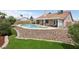 Landscaped backyard featuring a pool, spa, covered patio, and well-maintained lawn at 4753 Carefree Dr, Las Vegas, NV 89122