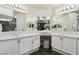 Luxurious bathroom featuring dual vessel sinks, marble countertops, and modern lighting fixtures at 4753 Carefree Dr, Las Vegas, NV 89122