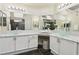 Spa-like bathroom with dual vanities, marble countertops, and modern lighting offering a luxurious retreat at 4753 Carefree Dr, Las Vegas, NV 89122