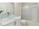 Chic bathroom showcasing a glass vessel sink on a marble countertop and a sliding glass door shower at 4753 Carefree Dr, Las Vegas, NV 89122