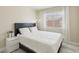Bright bedroom featuring a queen-size bed, natural light, and a minimalist design at 4753 Carefree Dr, Las Vegas, NV 89122