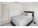 Cozy bedroom with a platform bed, light gray wood floors, and a bright, minimalist style at 4753 Carefree Dr, Las Vegas, NV 89122