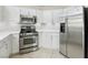 Modern kitchen featuring stainless steel appliances, white cabinets, and ample counter space perfect for cooking at 4753 Carefree Dr, Las Vegas, NV 89122