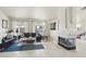 Bright living room featuring modern decor, tile floors, and a cozy fireplace ready for relaxation and entertaining at 4753 Carefree Dr, Las Vegas, NV 89122