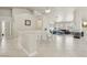 Expansive open-concept living space with tile floors, modern fireplace, and dining area for entertaining and relaxing at 4753 Carefree Dr, Las Vegas, NV 89122