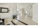 Open-concept living space with tile floors, modern fireplace, and seamless flow to dining and kitchen areas at 4753 Carefree Dr, Las Vegas, NV 89122