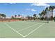 Well-maintained community tennis court surrounded by tall palm trees under a clear blue sky at 4753 Carefree Dr, Las Vegas, NV 89122