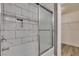 Bathroom featuring tiled shower with sliding glass door and built in storage at 507 Satin Saddle Pl, Henderson, NV 89052