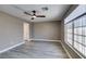 Well-lit bedroom with modern ceiling fan and wood-look flooring at 507 Satin Saddle Pl, Henderson, NV 89052