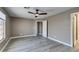 Spacious bedroom with modern ceiling fan and wood-look flooring at 507 Satin Saddle Pl, Henderson, NV 89052