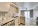 Bright kitchen features modern sink, granite countertops, stainless steel appliances, and wood-look flooring at 507 Satin Saddle Pl, Henderson, NV 89052