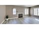 Inviting living room with a fireplace, light-colored flooring, and lots of natural light at 507 Satin Saddle Pl, Henderson, NV 89052
