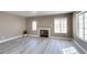 Spacious living room featuring a fireplace, tile flooring, and plenty of natural light at 507 Satin Saddle Pl, Henderson, NV 89052