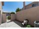 This patio features outdoor seating, an air conditioning unit, and privacy walls at 507 Satin Saddle Pl, Henderson, NV 89052
