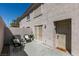 This patio features outdoor seating, a security door, and sliding glass doors at 507 Satin Saddle Pl, Henderson, NV 89052
