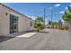 Gravel backyard with small patio, palm tree, and sliding door access at 5139 Zapata Ln, North Las Vegas, NV 89031