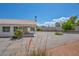 Spacious gravel backyard with covered patio and desert landscaping at 5139 Zapata Ln, North Las Vegas, NV 89031