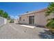 Gravel backyard featuring a small patio area and sliding door at 5139 Zapata Ln, North Las Vegas, NV 89031