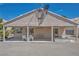 Backyard showcases covered patio with seating and gravel landscaping at 5139 Zapata Ln, North Las Vegas, NV 89031