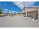 Spacious backyard with gravel, desert landscaping, privacy wall and covered patio space at 5139 Zapata Ln, North Las Vegas, NV 89031