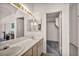 Bathroom features a dual sink vanity with a view into the walk-in closet at 5139 Zapata Ln, North Las Vegas, NV 89031