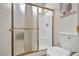 Updated bathroom features a shower with glass doors and a modern toilet at 5139 Zapata Ln, North Las Vegas, NV 89031