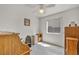 Bright bedroom with neutral walls, window, desk, and office chair at 5139 Zapata Ln, North Las Vegas, NV 89031