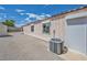 Home exterior with gravel, HVAC unit, and window with roll-down shade at 5139 Zapata Ln, North Las Vegas, NV 89031