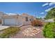 Charming single-story home with desert landscaping, a tile roof, and an attached two-car garage at 5139 Zapata Ln, North Las Vegas, NV 89031