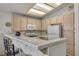 Bright kitchen featuring tile countertops and essential appliances at 5139 Zapata Ln, North Las Vegas, NV 89031