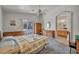 Spacious main bedroom boasts an ensuite bathroom, neutral paint, and a ceiling fan at 5139 Zapata Ln, North Las Vegas, NV 89031