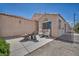 Private patio featuring outdoor seating, a decorative fountain, and access to the main house at 5139 Zapata Ln, North Las Vegas, NV 89031