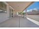 Spacious covered patio offers a sitting area overlooking the gravel backyard and desert landscaping at 5139 Zapata Ln, North Las Vegas, NV 89031