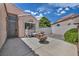 Cozy patio area with seating, a decorative fountain, and a private, gated entrance at 5139 Zapata Ln, North Las Vegas, NV 89031
