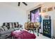 A bedroom with a cozy couch and decorative curtains at 5409 Flora Spray St, Las Vegas, NV 89130