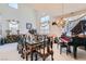 Elegant dining room with a grand piano, ornate dining set, and high ceilings for entertaining at 5409 Flora Spray St, Las Vegas, NV 89130