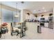 Bright dining area next to the kitchen, featuring stainless steel appliances and ample natural light at 5409 Flora Spray St, Las Vegas, NV 89130
