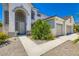 A home with well maintained landscaping and an oversized front door at 5409 Flora Spray St, Las Vegas, NV 89130