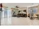 Open-concept living room with tile flooring, and backyard access at 5409 Flora Spray St, Las Vegas, NV 89130