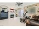 Inviting living room featuring a fireplace, tile flooring, and backyard access at 5409 Flora Spray St, Las Vegas, NV 89130