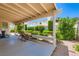 Relax on this home's shaded back patio with view of well maintained yard at 5413 Flora Spray St, Las Vegas, NV 89130