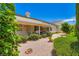 Rear exterior view showcasing the covered patio and landscaped backyard at 5413 Flora Spray St, Las Vegas, NV 89130