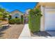 Welcoming home featuring manicured front yard landscaping and a charming walkway leading to the entrance at 5413 Flora Spray St, Las Vegas, NV 89130