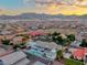 A stunning aerial view of the property, highlighting the pool, landscaping, and mountain views at 5438 Sierra Brook Ct, Las Vegas, NV 89149
