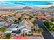 Aerial view of a desert home with backyard pool, covered patio, and mature landscaping at 5438 Sierra Brook Ct, Las Vegas, NV 89149