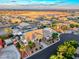 Aerial view of a desert home with lush palm trees, desert landscaping, and a backyard pool and spa at 5438 Sierra Brook Ct, Las Vegas, NV 89149