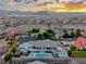 Desert home with swimming pool, deck and covered patio, captured in an aerial view at 5438 Sierra Brook Ct, Las Vegas, NV 89149