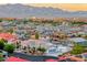 Residential neighborhood with mountain views, showcasing a home with desert-style landscaping at 5438 Sierra Brook Ct, Las Vegas, NV 89149